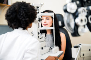 A patient is having an eye exam at the optometrist.