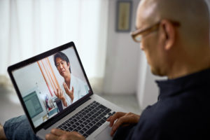 Cardiovascular doctor talking to patient via internet