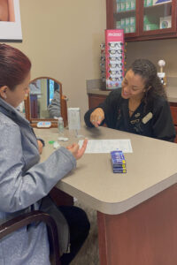 A contact-lens technician works with a patient in Dr. Cargo's office. Dr. Cargo says a few key actions have changed patient service and profitability in the contact-lens area of his practice.