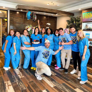 Dr. Mena with his practice team. Dr. Mena says it's important to keep both doctor and practice team well-being in mind as you serve patients and grow your practice.