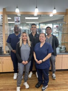 Dr. Chung, back row, center, with his practice team. Dr. Chung says Revenue Cycle Management (RCM) from VisionWeb has made a huge difference to his ability to be paid in a timely manner.