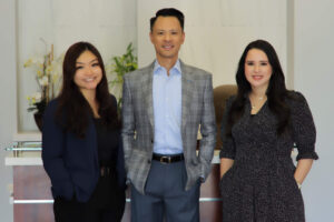 Dr. Gee, center, with his practice partners, Jessica Nguyen, OD, to his left (as you're looking at the photo) and Thuria Younis, OD, to his right. Dr. Gee says that he and his partners have found remote workers a great solution to freeing their support staff up to do what they do best.