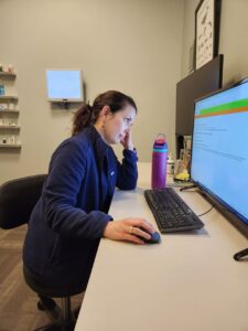 Susan Shauger, OD, from Dr. Sorrenson's practice, Lakeline Vision Source, reviewing charts. Dr. Sorrenson says that charting after hours is not the norm. It's a sign you may need to make a change in how you do this task.