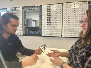 Opticians Dana Jagodzinski and Ben Collings at work in Dr. Gosling's office. He says that HOYA's new iD LifeStyle® lenses do wonders for both patients' quality of life and practice profitability.