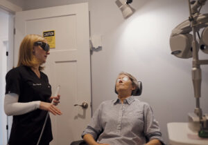 Dr. Foster with a patient receiving intense pulsed light (IPL) therapy. Dr. Foster says IPL, and her other dry eye treatments, have offered a significant boost to both patient care and profitability.