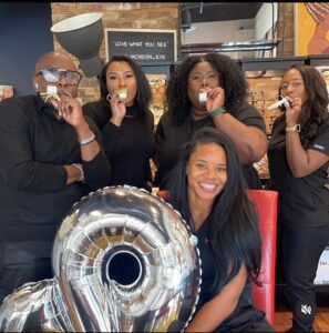 Shyesha Kincy (second from right back row as you look at photo) with the practice team at Jackson Eye in Fairburn, Ga. Kincy who serves as practice manager, says Paradeyem significantly improved the practice's ability to provide a great patient experience while capturing more eyewear sales.